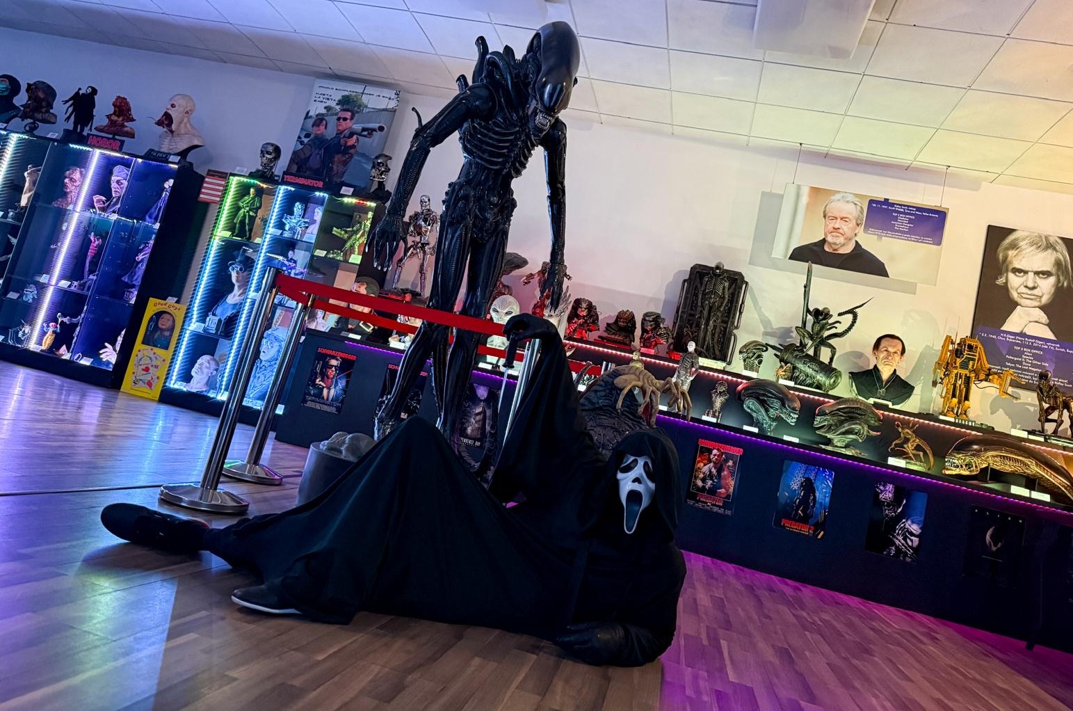 Team members in Ghostface costumes in the exhibition